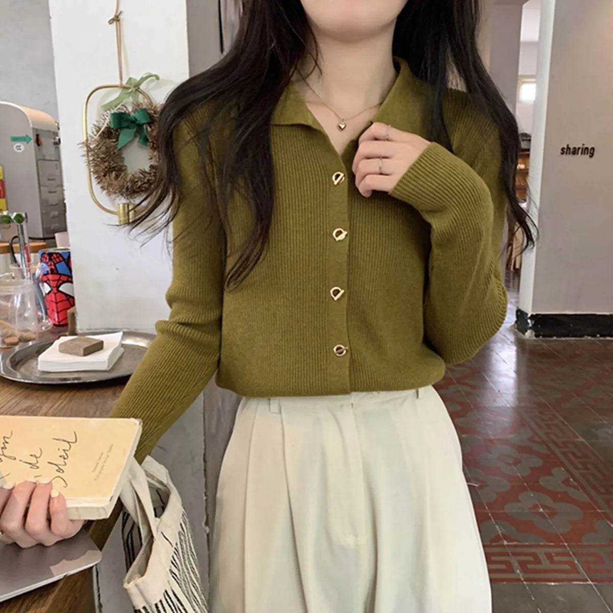Women's long-sleeved loose fit viscose cardigan top in beige, shown as a layering piece.