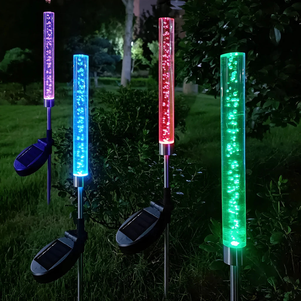 Solar bubble stick lawn lamp with colourful slow flash crystal bubble effect in garden setting