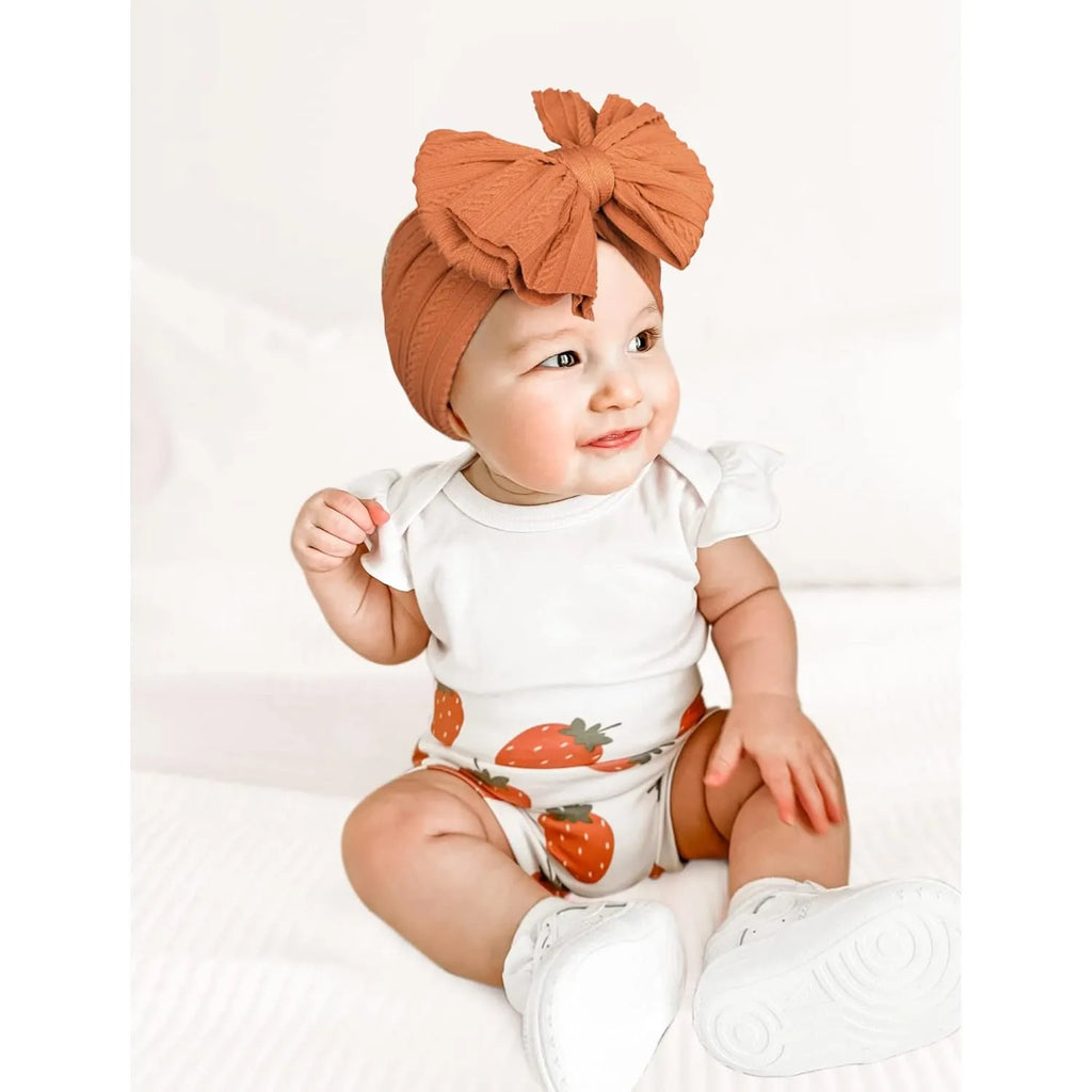 Handmade stretchy nylon baby headband with bow on newborn girl