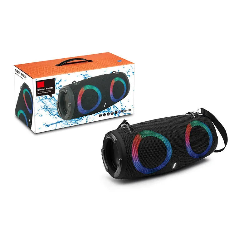 War Drum portable Bluetooth speaker with multi-colour RGB lights, showing carry strap and waterproof casing.