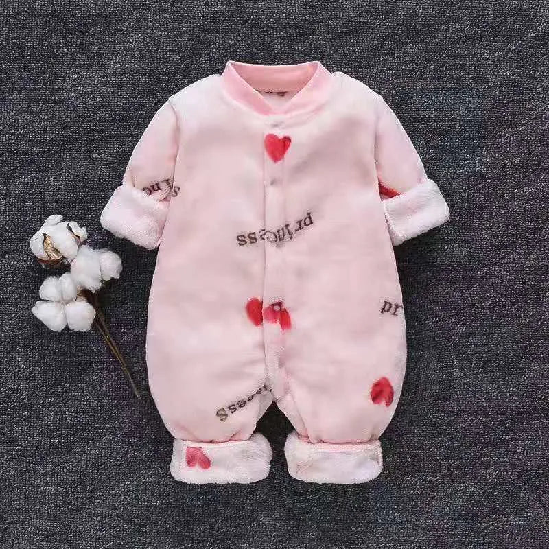 Baby wearing a long sleeve flannel romper with a printed panda pattern in pink and blue.