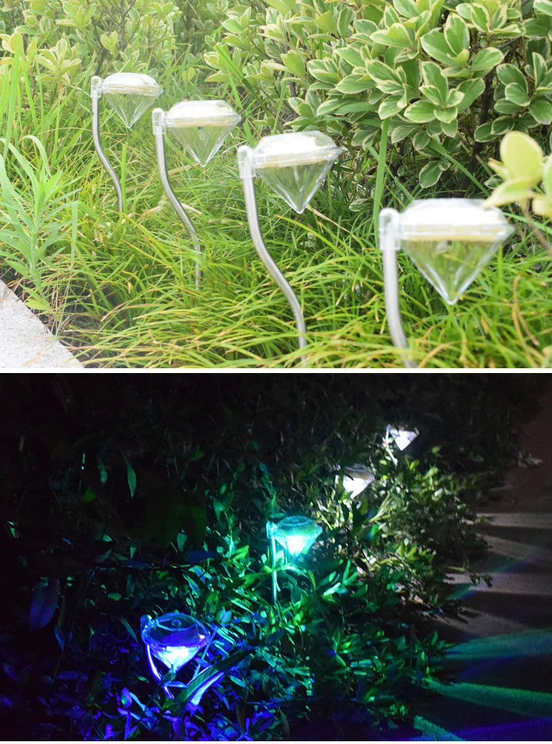 Solar-powered diamond-shaped garden light with solar panel on adjustable stake.