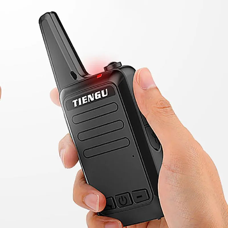 TIENGU black handheld two-way radio with antenna, LED flashlight, and back clip on a plain background