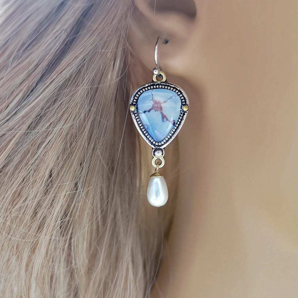 Retro blue bohemian drop earrings with synthetic opal and white pearl on metal.