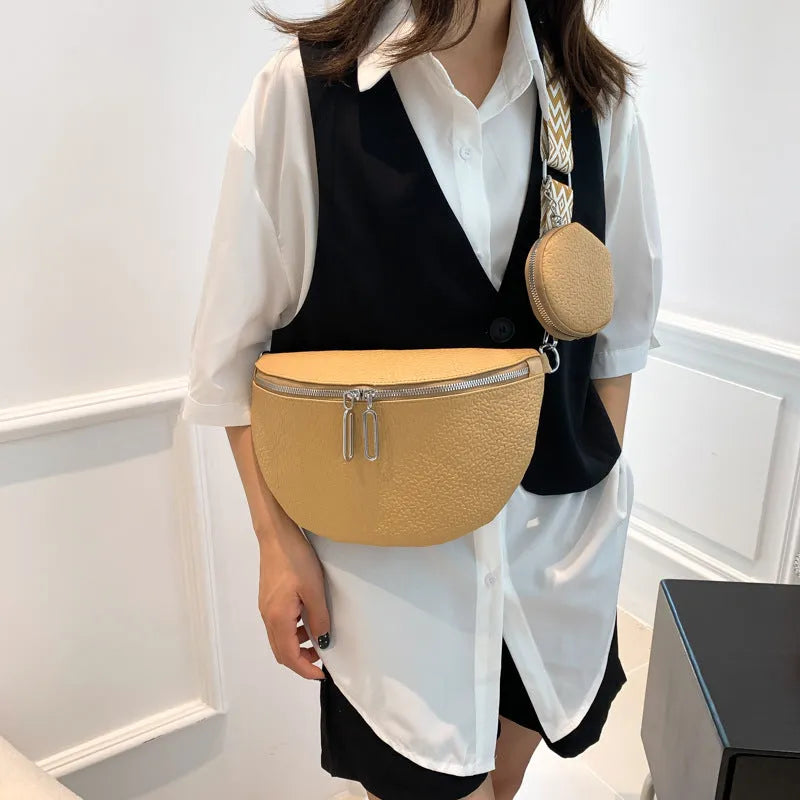 Solid colour women's crossbody bag with textured saddle lock zipper detail in a horizontal square shape