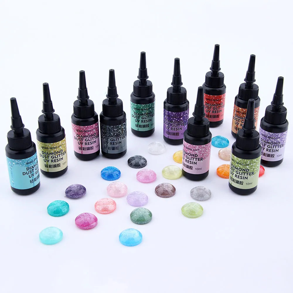 UV epoxy diamond 24 colour set with gold, silver, blue, pink, and green sequins on a white surface