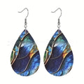 Printed acrylic drop earrings with flat branch knot geometric design on white background