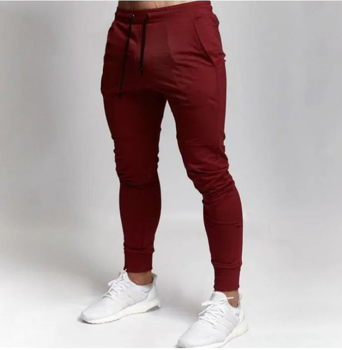 Men's slim fit gym pants in black with elastic waistband, available in multiple colours and sizes