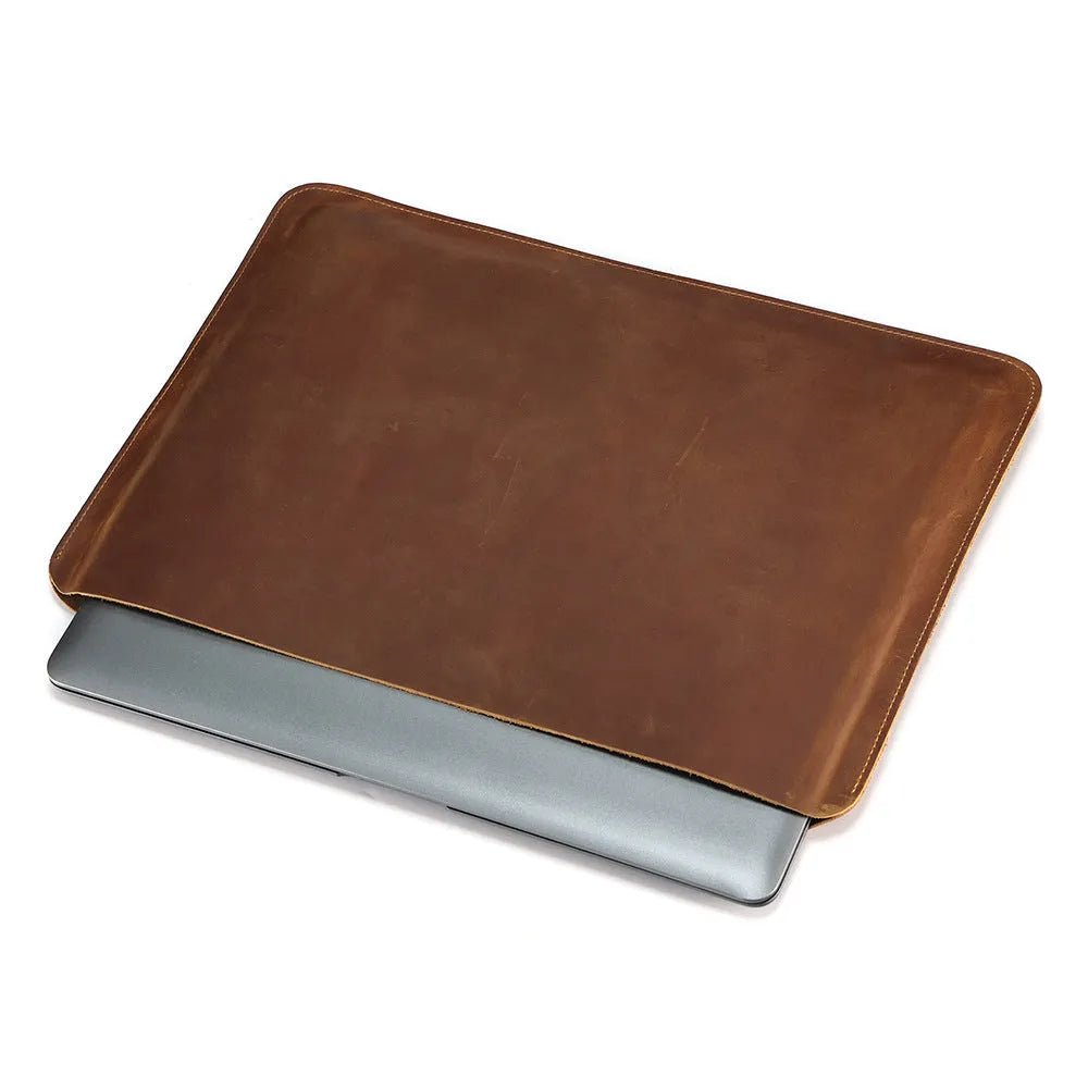 Brown genuine leather horizontal computer bag liner organiser with a laptop inside