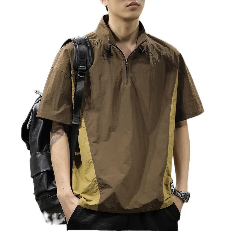 Brown men's half-zip stand collar short sleeve shirt with a fleece-lined interior on a hanger.