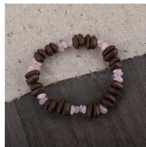 Handmade coffee bean bracelet with 16mm geometric charm showing colour variations