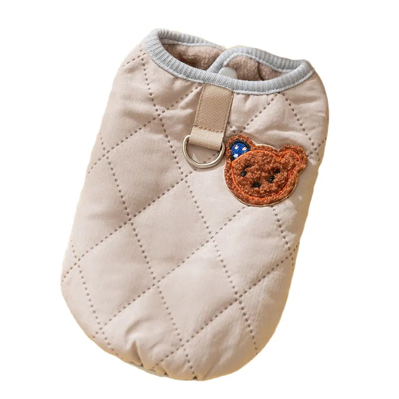 Quilted pet vest with bear patch embroidery on cream background for small dogs