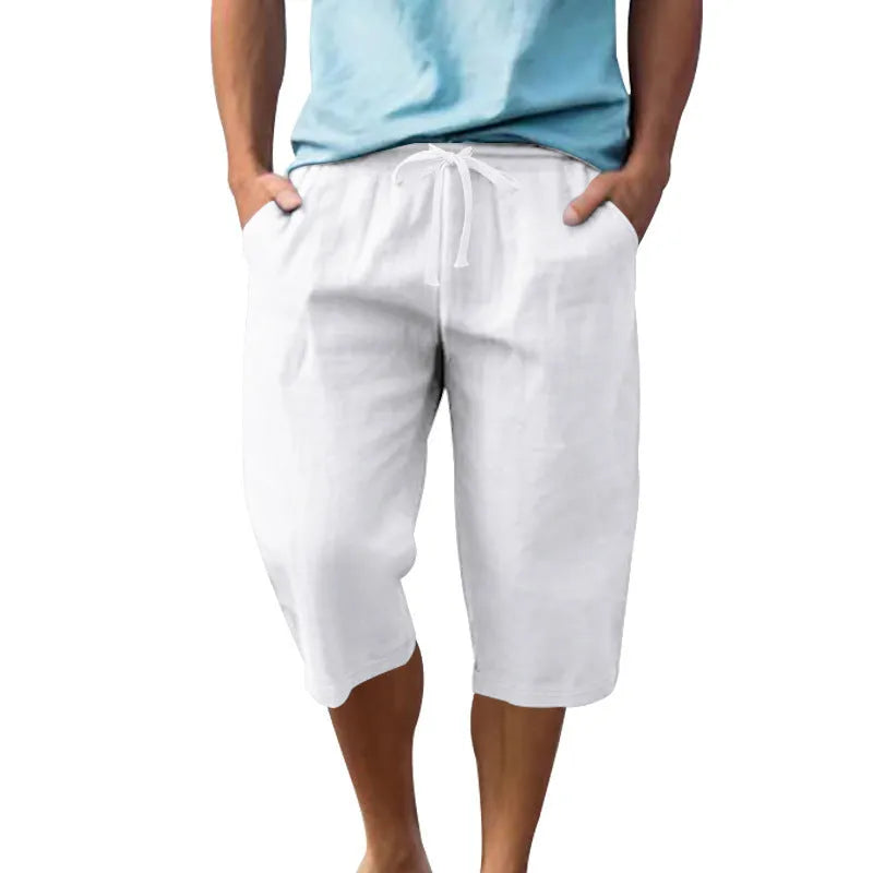 Men's solid colour linen shorts with a drawstring waistband in a light blue shade