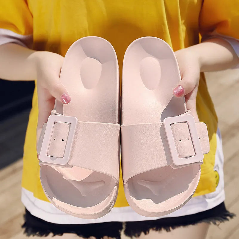 Women's grey blue EVA buckle slipper with a 1.5cm thick sole and adjustable strap.
