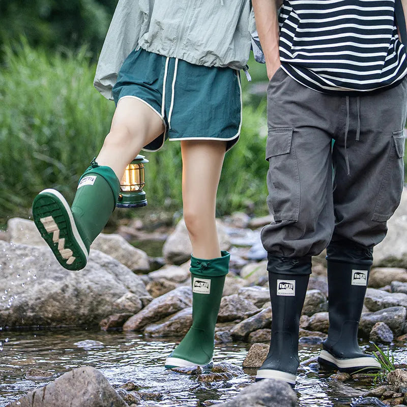 Solid colour high tube PVC rain boot in beige, shown on a white background.