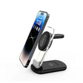 Transparent folding magnetic three-in-one wireless charger showing internal coil, in black, on a desk.