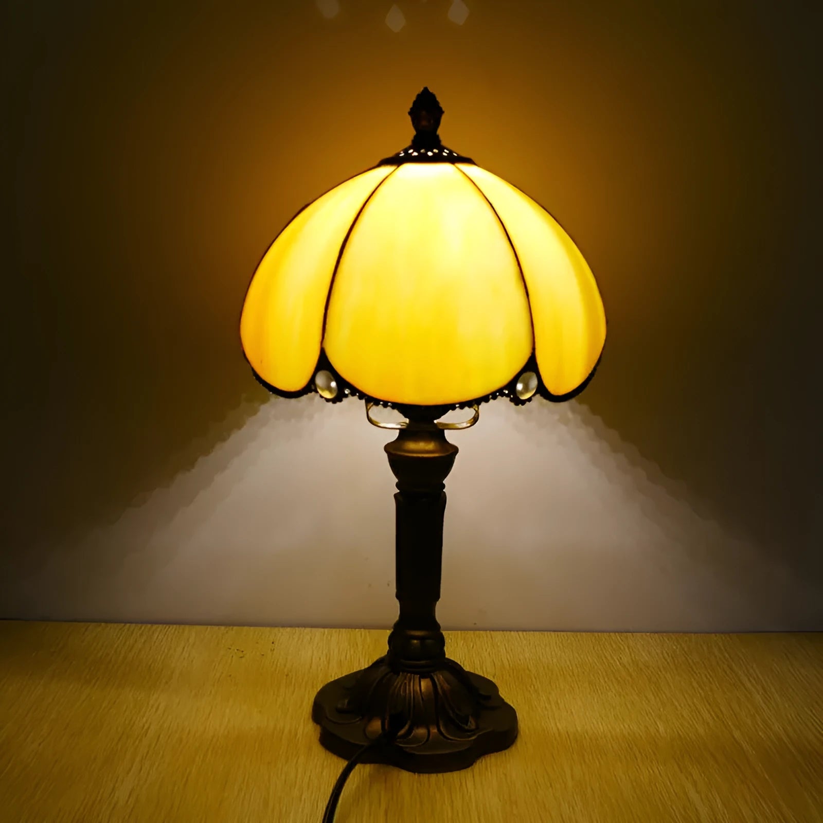 Beige bedside table lamp with simple modern design measuring 20cm wide