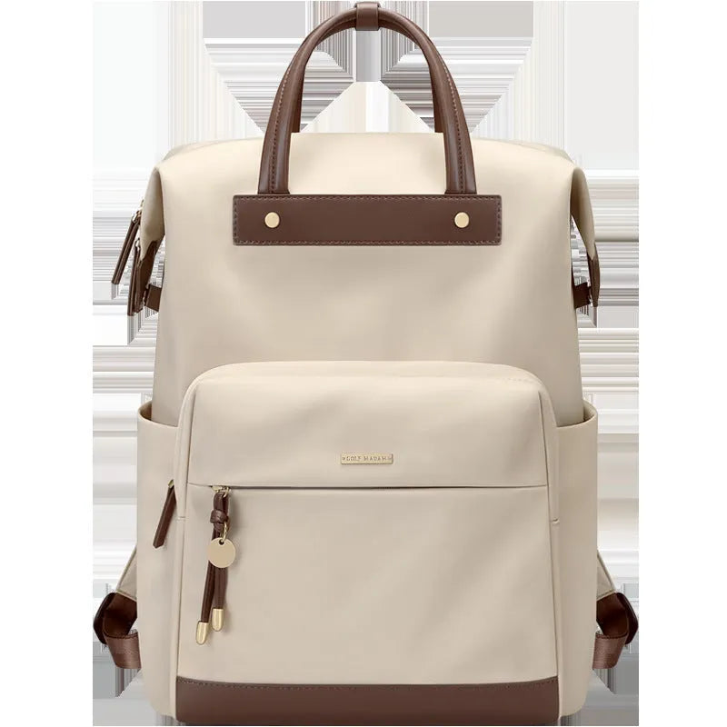 Large apricot coloured backpack with adjustable straps on a grey background