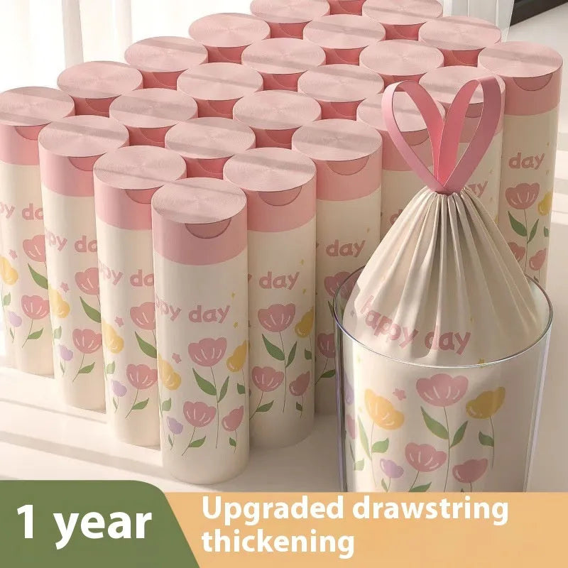 Pink degradable drawstring garbage bags with argy wormwood infusion for mosquito repellency, shown in a pack.