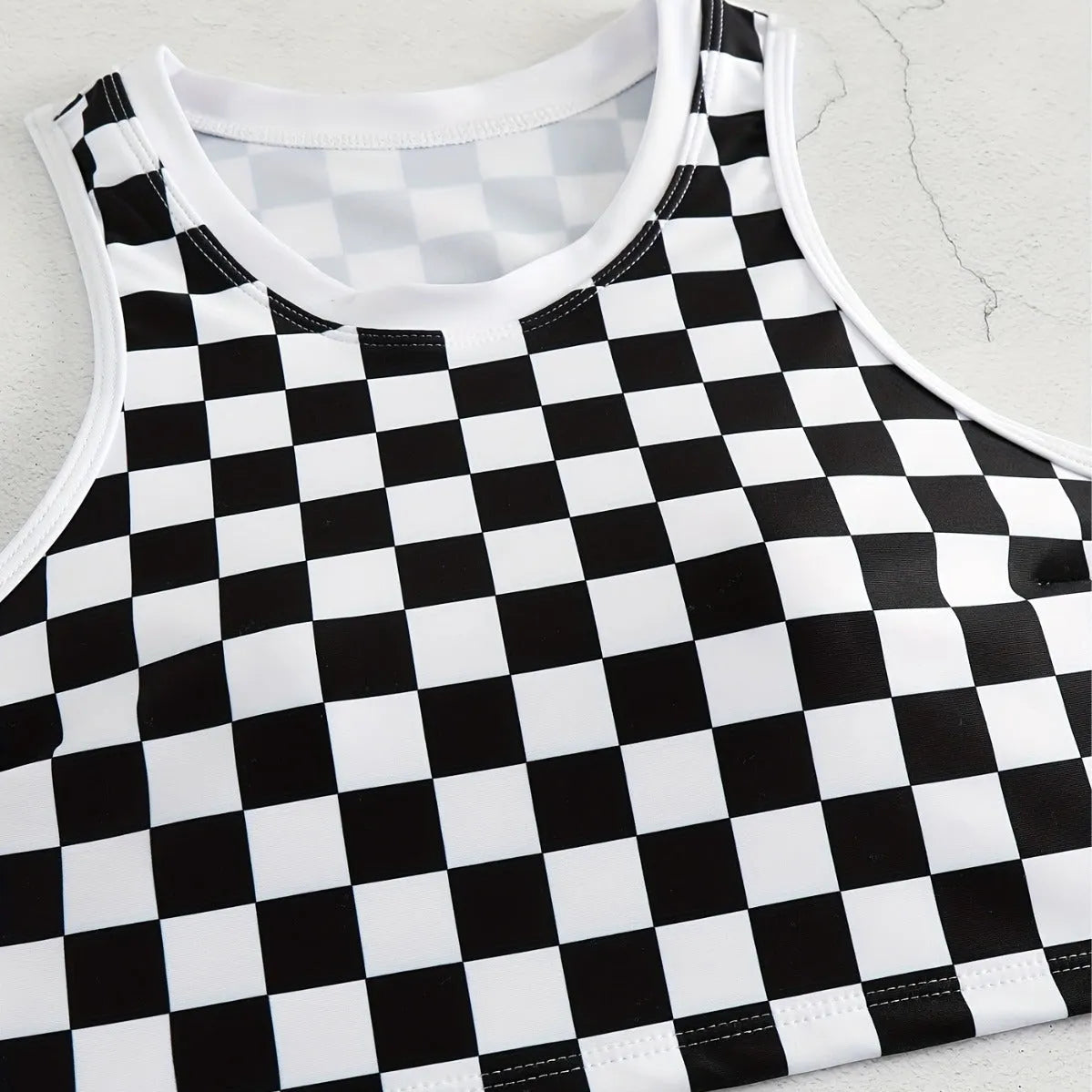 Women's racing one-piece swimsuit with suspender straps and chessboard pattern