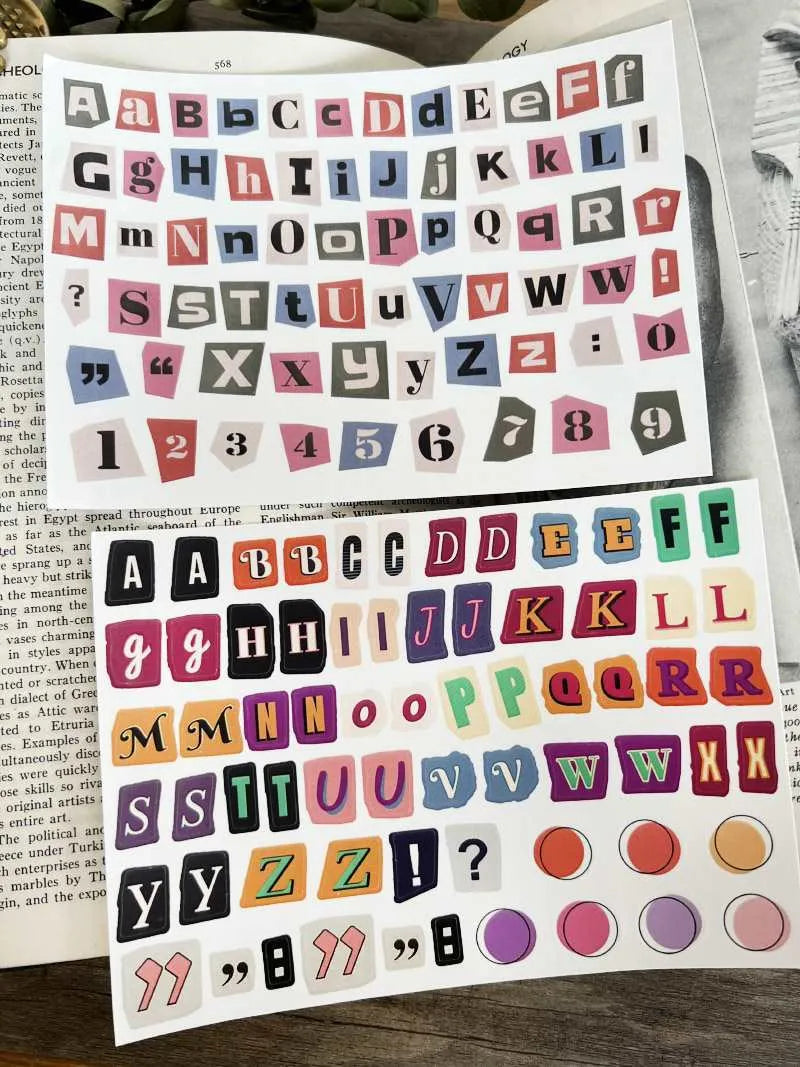 Pack of printed decorative stickers showing English letters, numbers, symbols, and weekly words in a cute style.