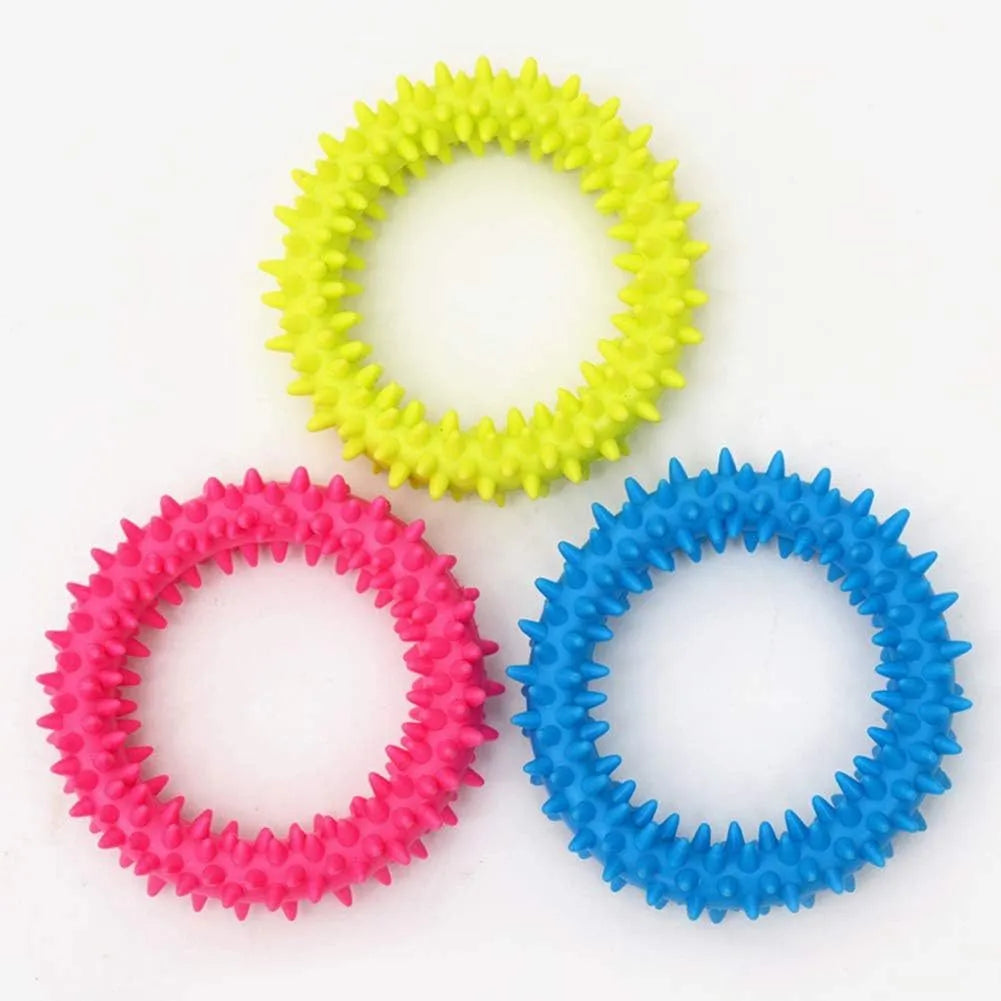 Blue TPR spiky circle ring dog chew toy for teeth cleaning on a white background.