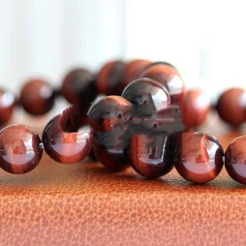 Wood alexandrite bracelet with red tigereye lightning cat's eye pattern and geometric round beads