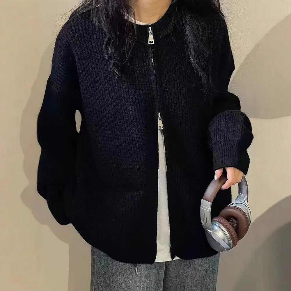 Beige viscose knit sweater coat cardigan with long sleeves laid flat.