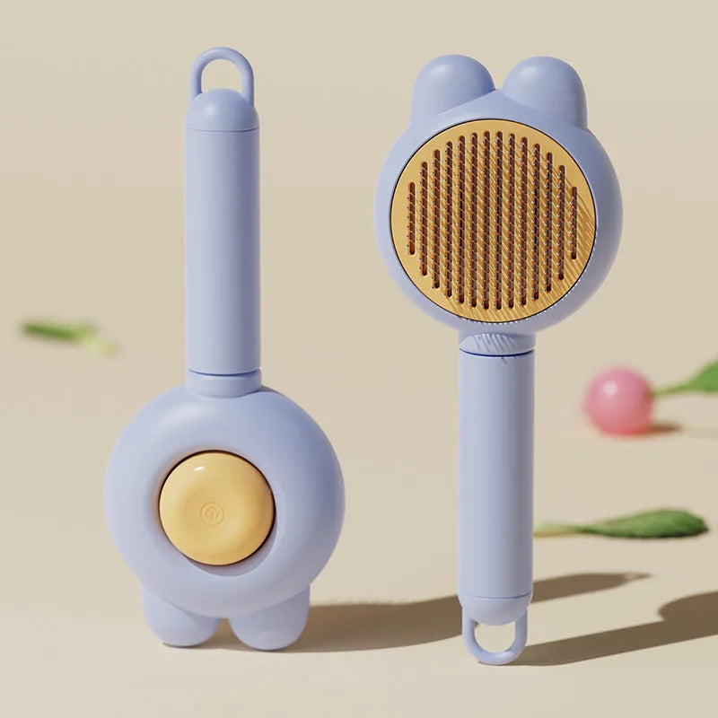 Self-cleaning pet hair brush with release button and rubber-tipped metal pins for cats and dogs.