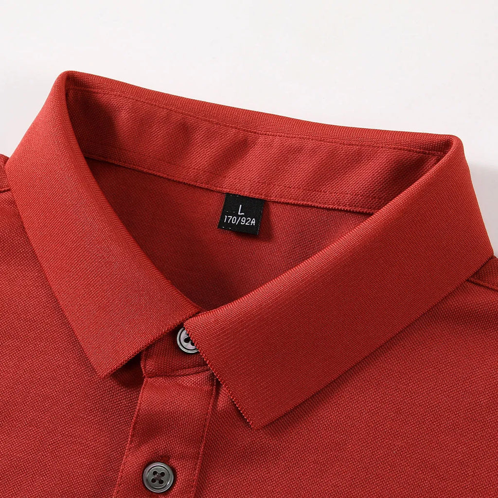 Short-sleeved lapel collar t-shirt in mulberry silk cotton blend on a hanger, showing mosaic detail.