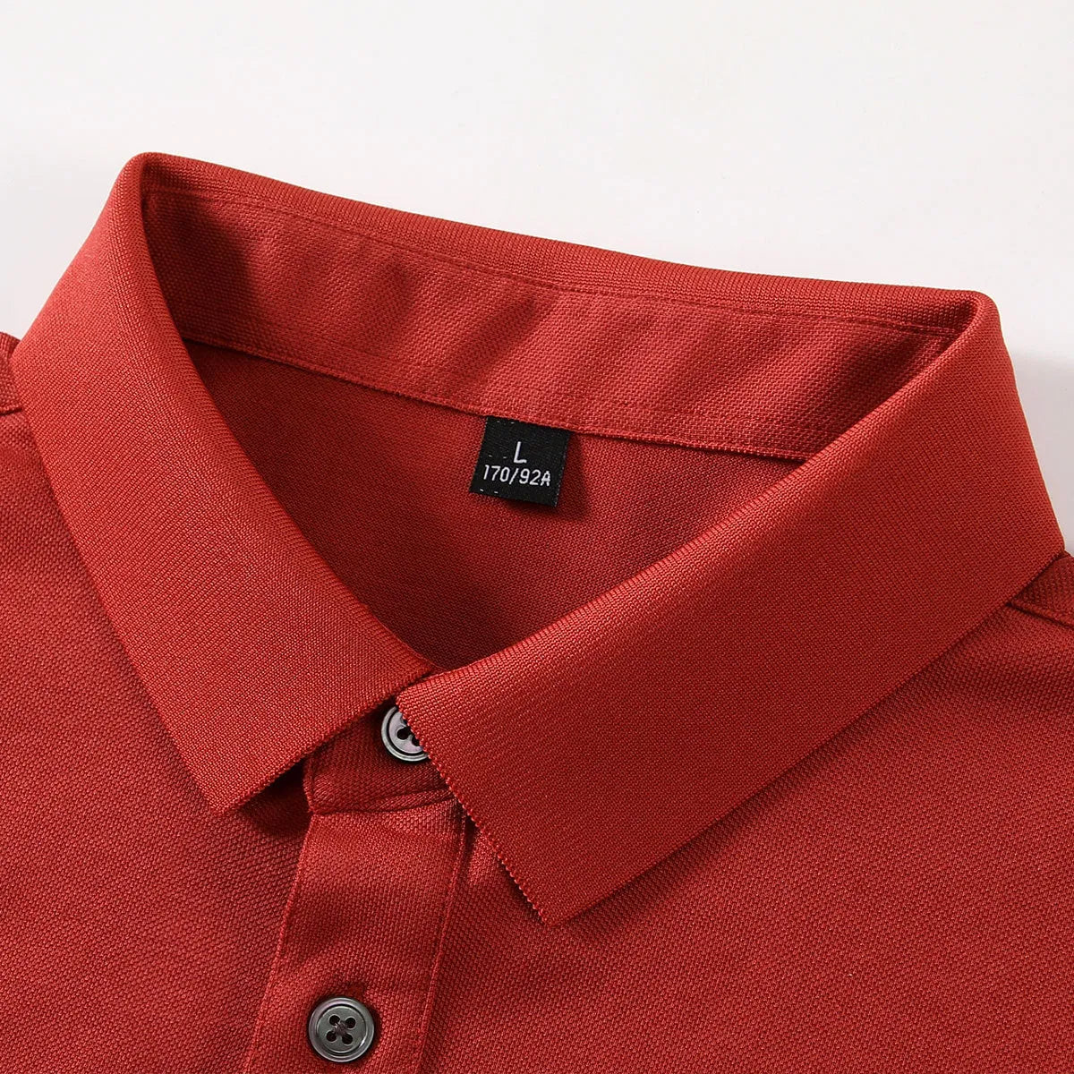 Short-sleeved lapel collar t-shirt in mulberry silk cotton blend on a hanger, showing mosaic detail.