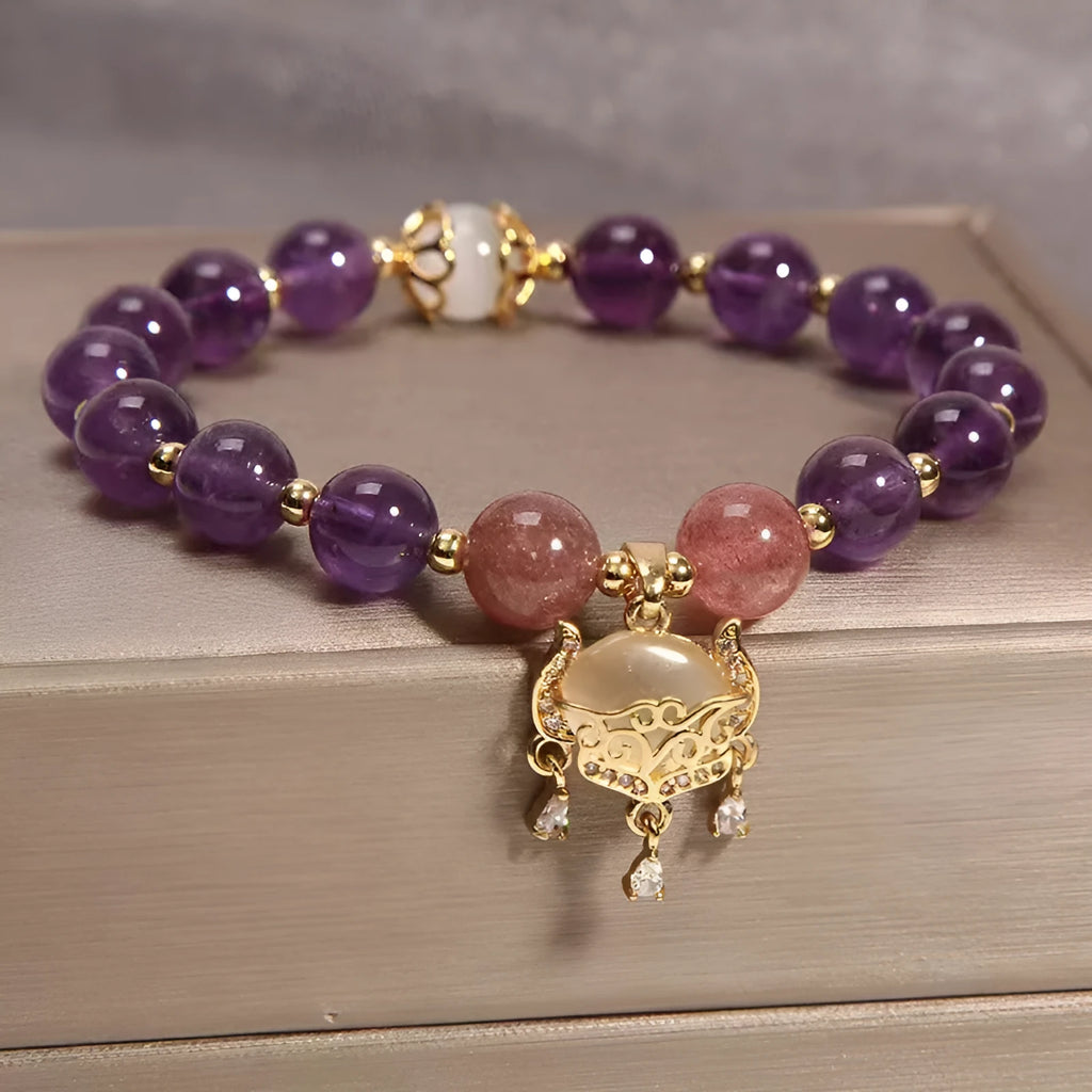Women's copper bracelet with natural amethyst gemstones and drop-shaped longevity lock charm