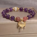 Women's copper bracelet with natural amethyst gemstones and drop-shaped longevity lock charm