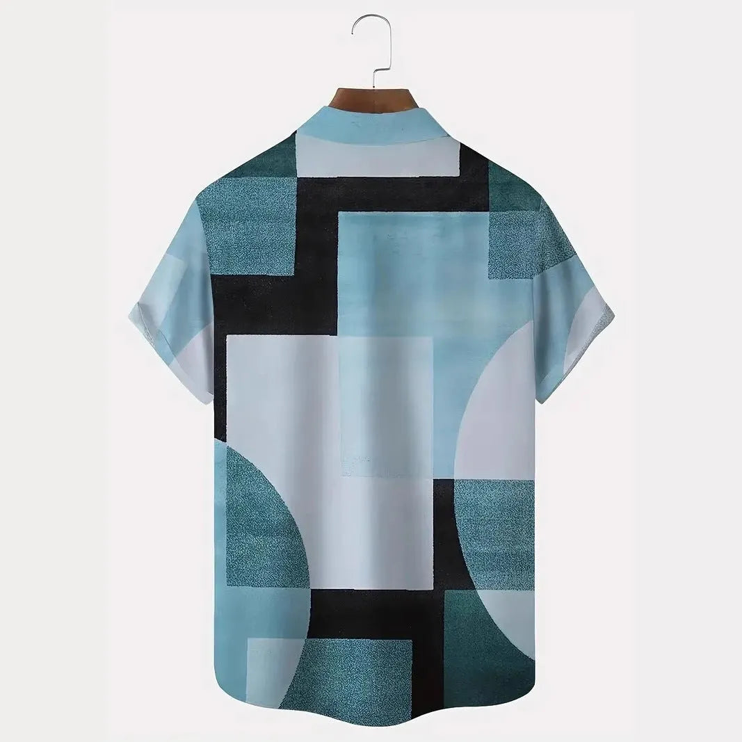 Man wearing a loose-fit short sleeve cardigan shirt with a blue and white geometric 3D print pattern.