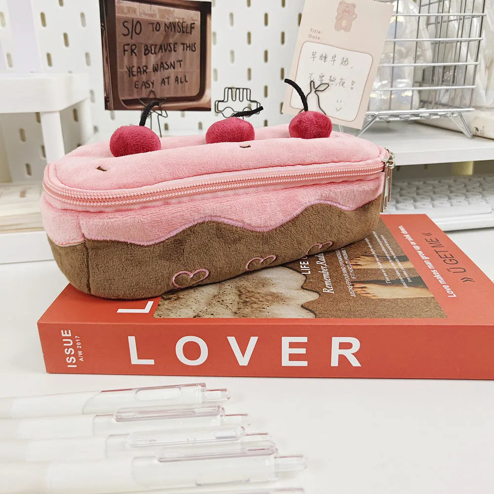 A Cherry Cake themed plush pencil bag made from soft velvet fabric.