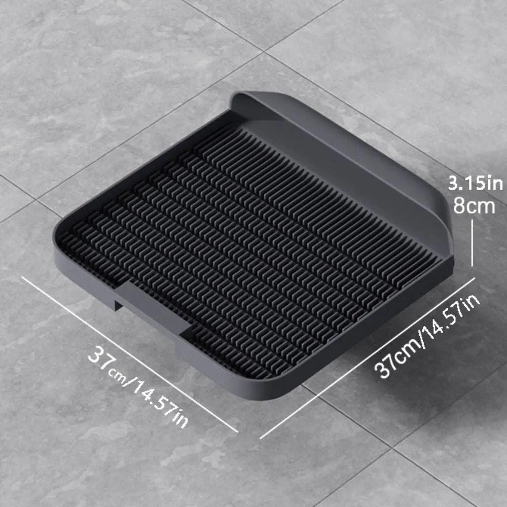 Large square black cat litter pedal mat with slanted design and textured grooves