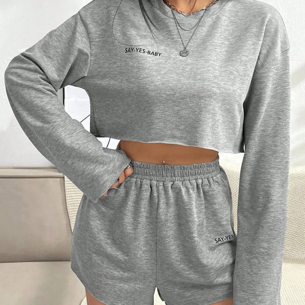 Grey women's long-sleeved T-shirt and matching shorts sleepwear set laid flat