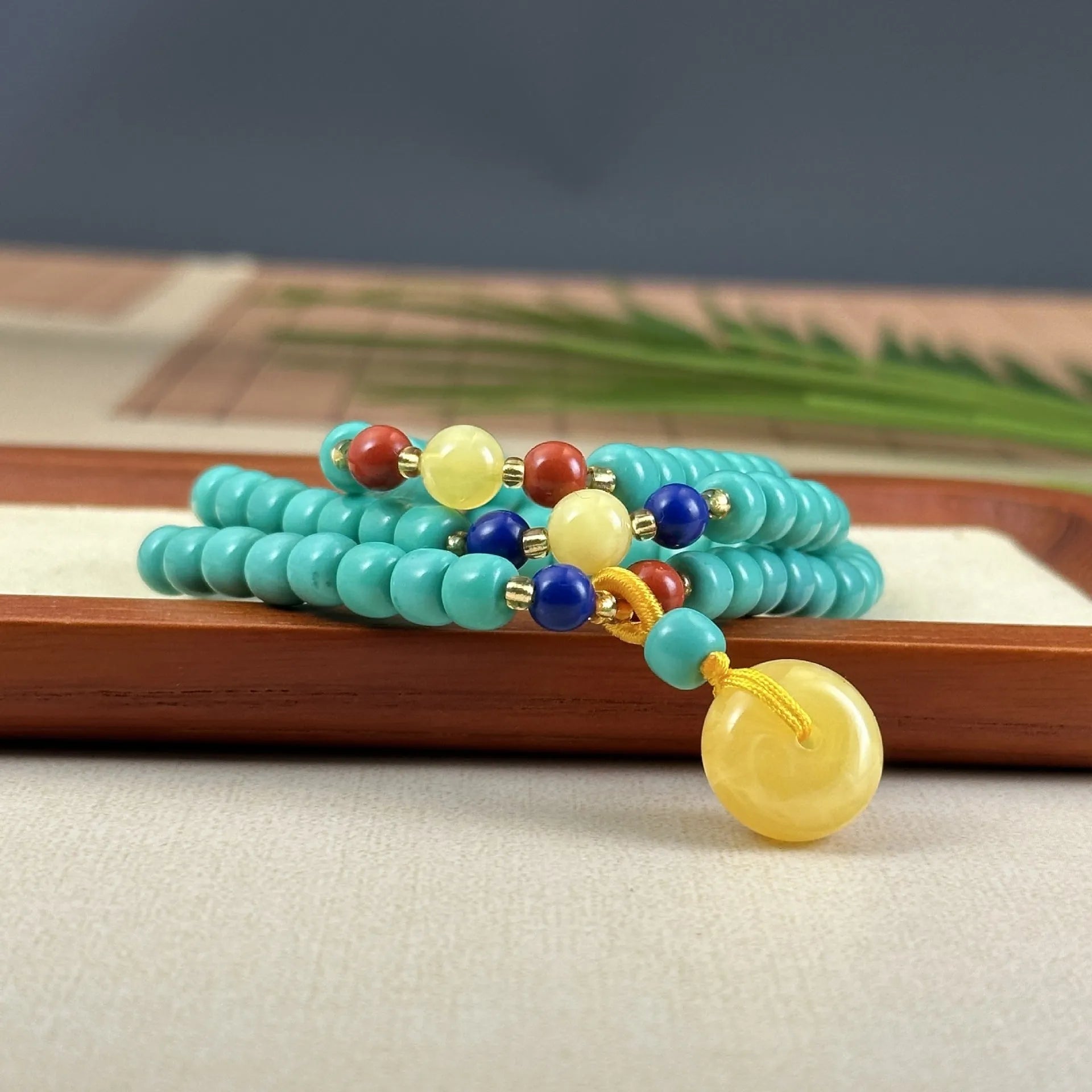 Turquoise stone mesh flower pendant on an adjustable ball bead necklace chain.