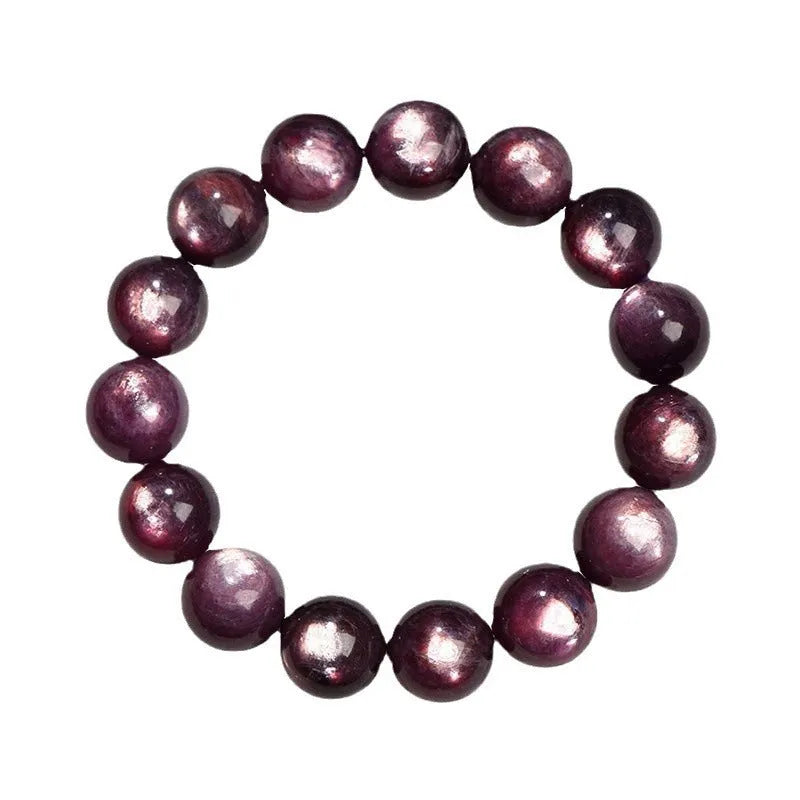 Purple lepidolite crystal round bead bracelet on a wrist, showing polished stones.