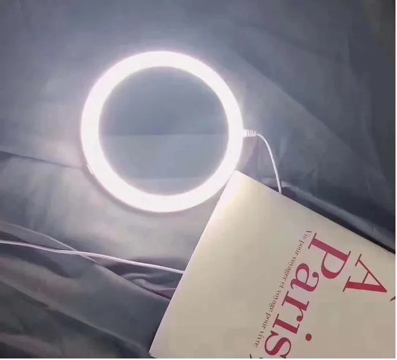 White acrylic LED vanity mirror with foldable design and USB charging port