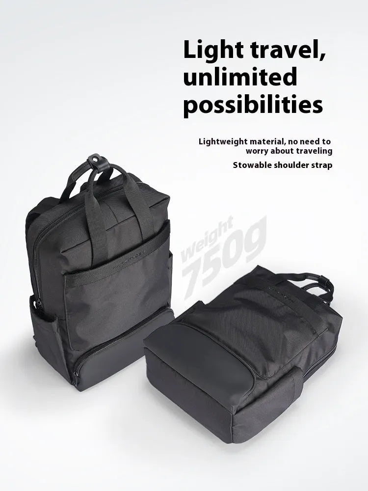Black Oxford cloth computer backpack showing front view and storage compartments.