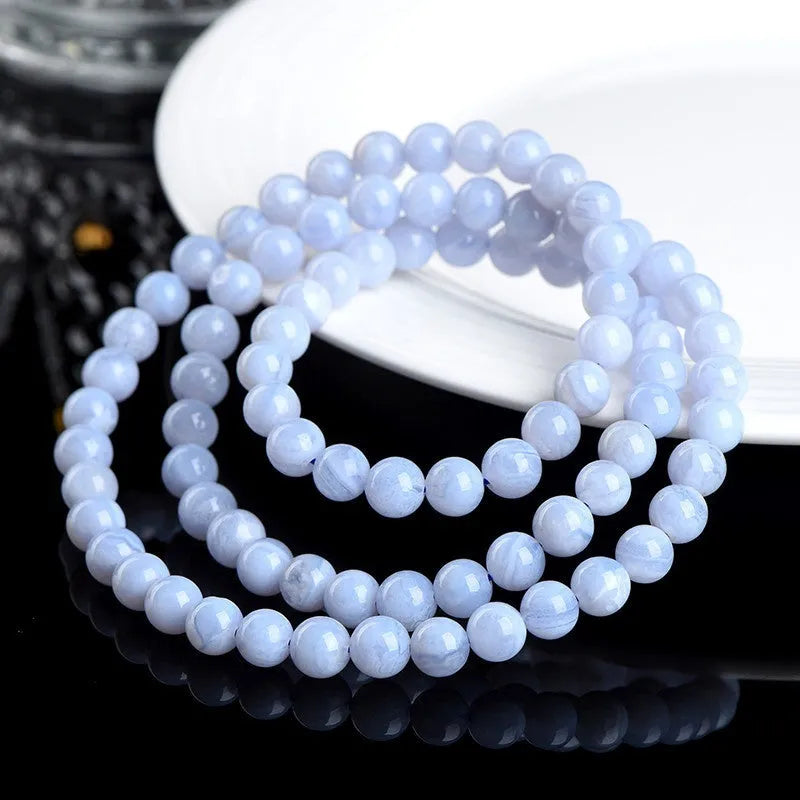 Original blue agate bracelet with multi-circle patterned beads and Ruyi design elements.