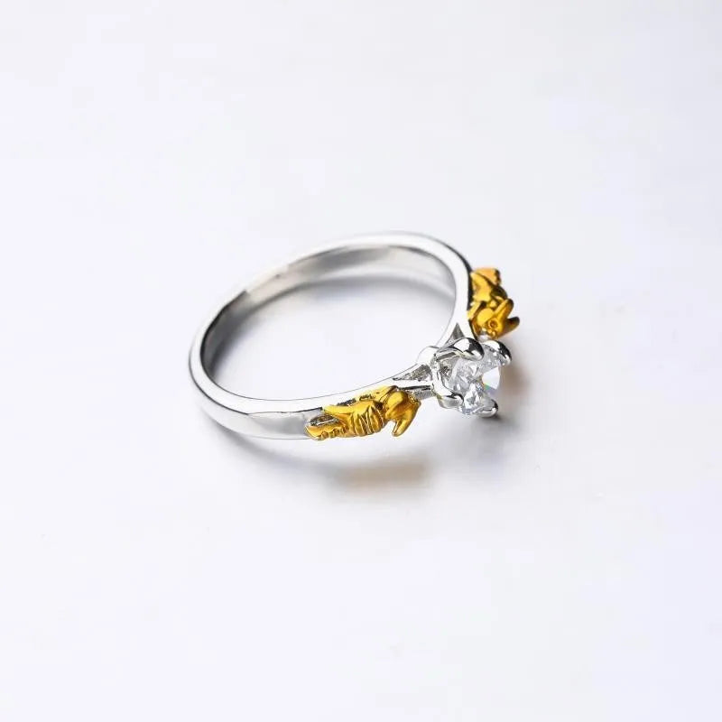A black gold finished crown motif ring on a copper base, shown on a finger, with detailed modelling visible.