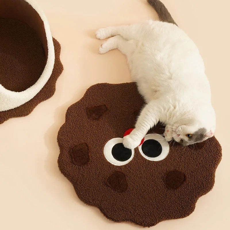 Khaki coloured enclosed cat house shaped like a sandwich cookie nest with a single entry.