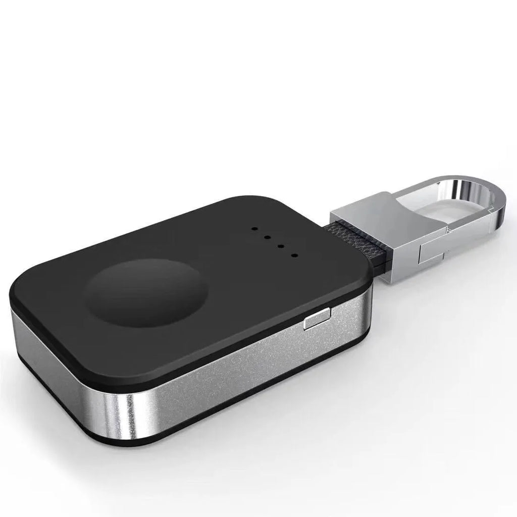 Black Apple Watch wireless keychain power bank showing compact size and charging surface.