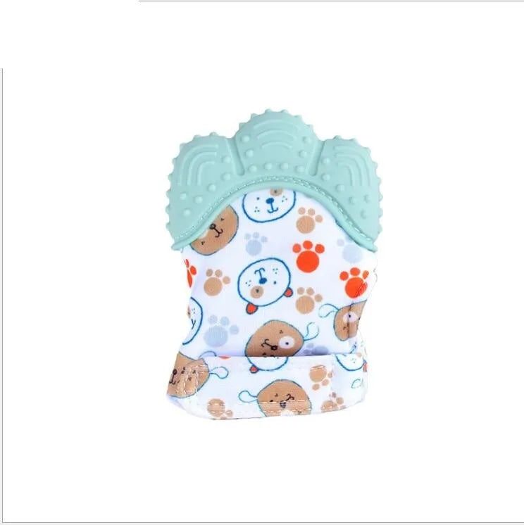 BPA-free silicone baby teether glove fastened with a white Velcro strap on a baby's hand