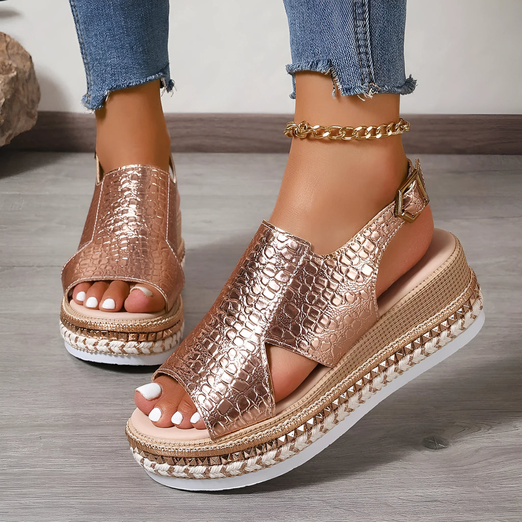 Gold women's Roman sandals with round toe and adjustable ankle buckle.