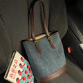 Retro blue denim patchwork one-shoulder bucket bag with large capacity.