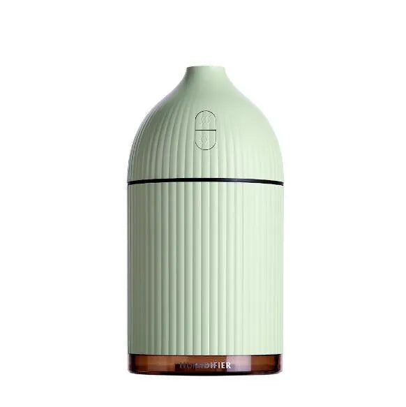 White USB-powered ultrasonic aromatherapy diffuser and humidifier with LED light on a wooden surface.