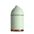 White USB-powered ultrasonic aromatherapy diffuser and humidifier with LED light on a wooden surface.